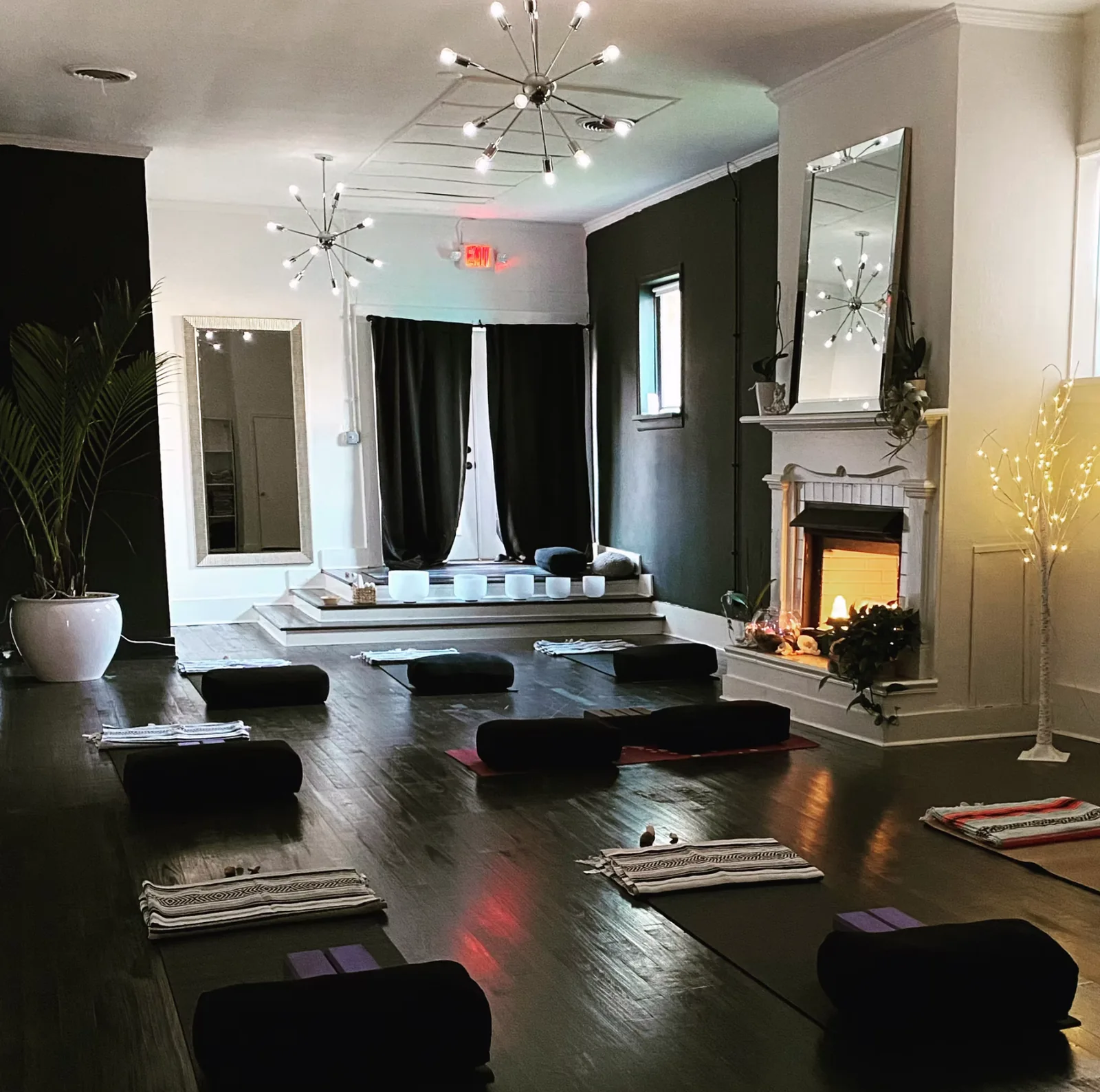 Mats and bolsters laid out in the Village Yoga studio
