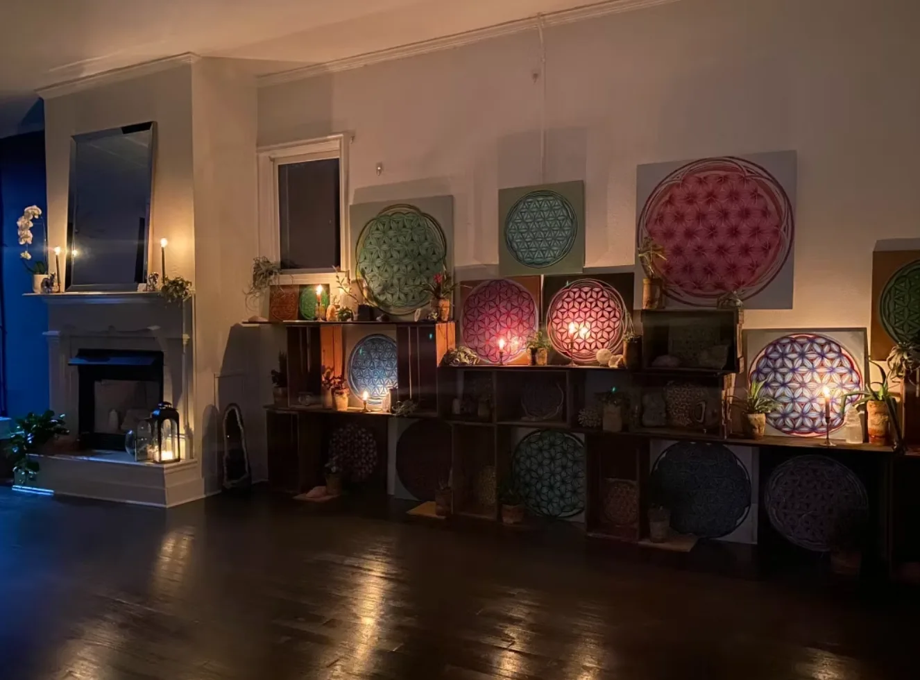 Candlelight and artwork in the Village Yoga studio